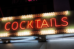 neon sign advertising cocktails