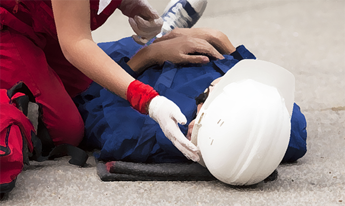 An injured worker get help from emergency services. 