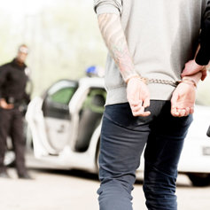 Police arresting a drug addict