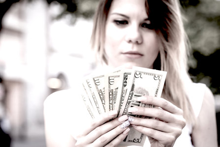 Young woman counting money
