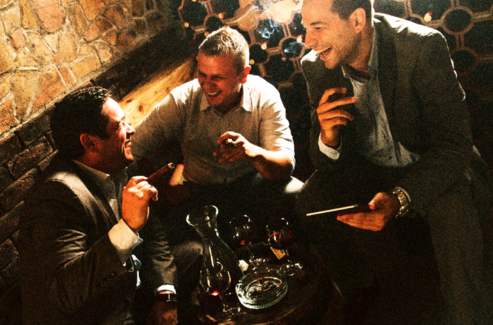 Men unwinding with a few drinks after a long day at work may conceal underlying addictions. 