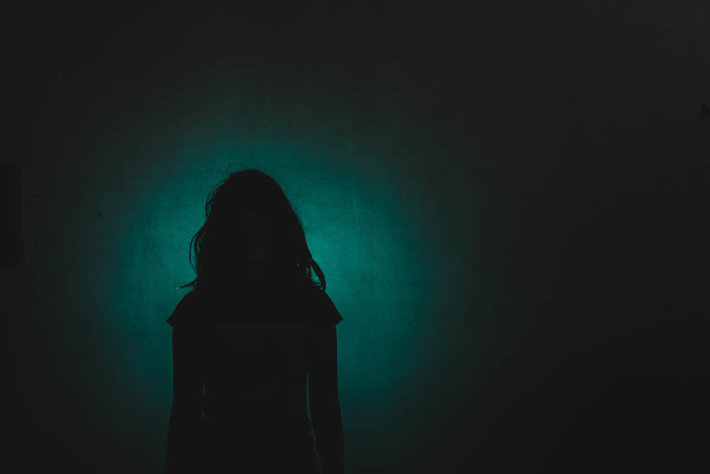 silhouette of hopeless young woman 