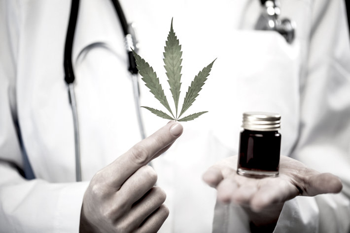 Medical staff holding marijuana.