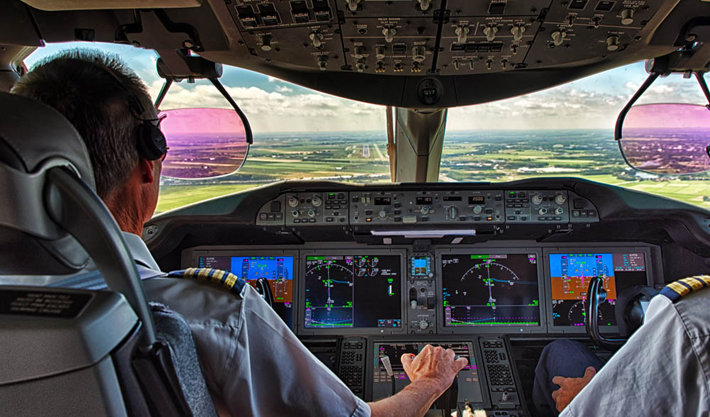 airline pilot in cockpit 