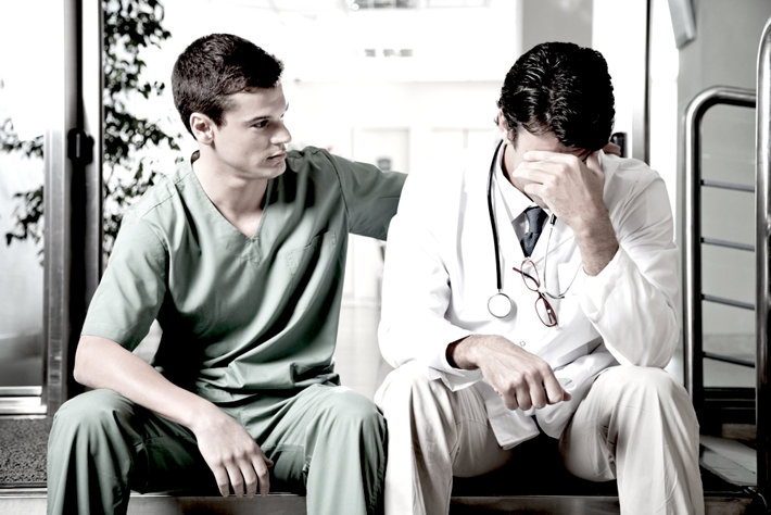 Doctor helps upset friend-doctor.